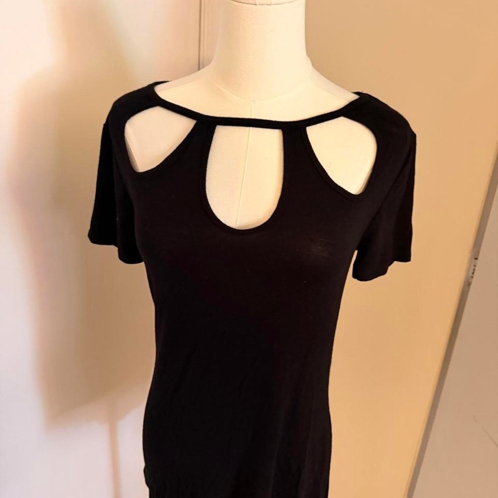 Jennifer Lopez black cut out top with cutouts on the shoulders and neckline